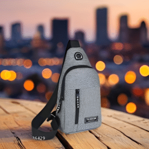 Gray unisex waterproof sling bag displayed on wooden surface