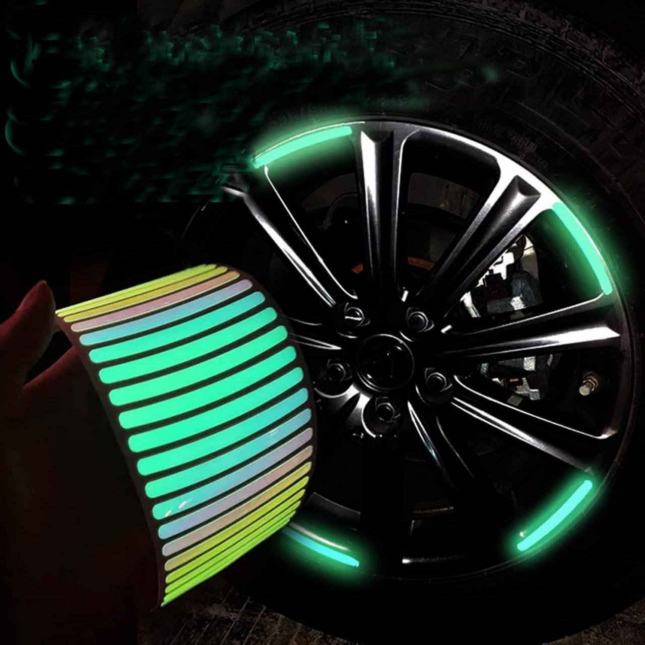 Reflective car wheel stickers glowing green in low light